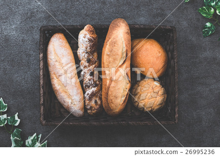 Lots of bread in the basket 26995236