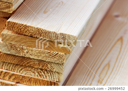 Pile of new wooden boards on a storage Pile of new wooden boards on a storage 26999452