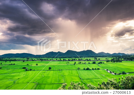 Mountain green field raining storm phenomenon 27000613
