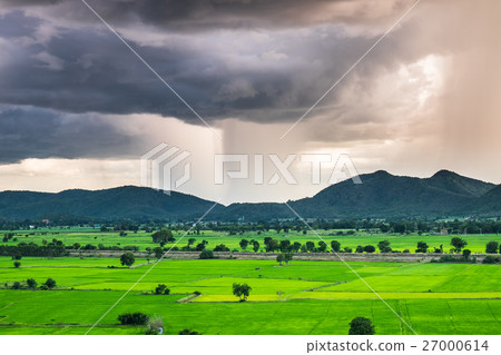 Mountain green field raining storm phenomenon 27000614
