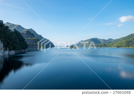 Dam blue water with mountain range clear Dam blue water with mountain range clear 27001098