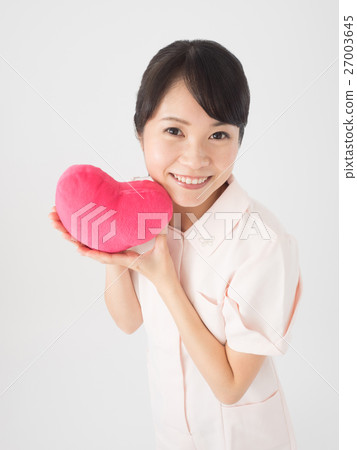 A nurse woman with a pink heart A nurse woman with a pink heart 27003645