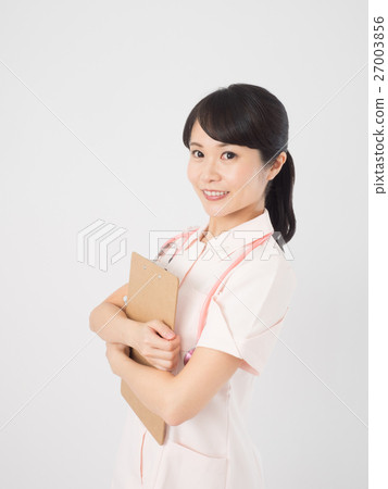 A woman nurse with a clipboard A woman nurse with a clipboard 27003856