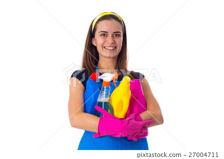 Woman in apron holding a detergents Woman in apron holding a detergents 27004711