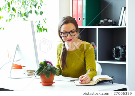 Young woman working from home - business concept Young woman working from home - business concept 27006359