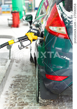Car refueling on a petrol station in winter 27006958