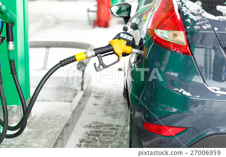Car refueling on a petrol station in winter 27006959