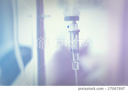 Close up IV saline solution drip for patient 27007897
