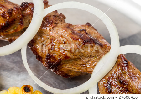 Traditional beef shish kebab on skewers. Traditional beef shish kebab on skewers. 27008410