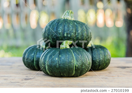 Japanese pumpkin on wooden board Japanese pumpkin on wooden board 27010199