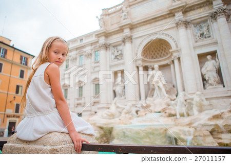 Adorable little girl background Trevi Fountain 27011157