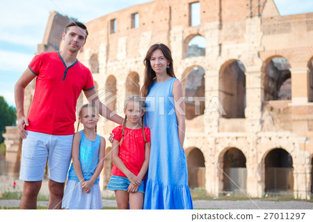 Happy family of four at italian vacation on 27011297