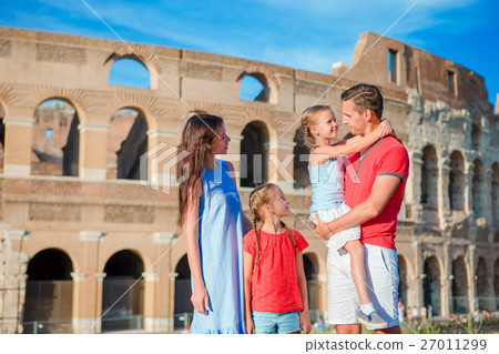 Happy family of four at italian vacation on 27011299