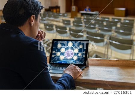 Businessman sitting and using computer laptop showing the Social media symbol over the Meeting Blurred background at bright conference hall, Business meeting concept Businessman sitting and using computer laptop showing the Social media symbol over the Meeting Blurred background at bright conference hall, Business meeting concept 27016391