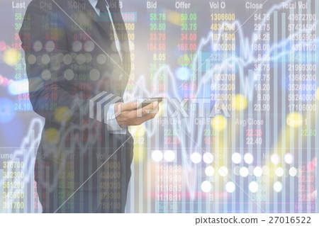 Double exposure of businessman holding mobile phone over the soft screen of stock market background, business trading concept Double exposure of businessman holding mobile phone over the soft screen of stock market background, business trading concept 27016522