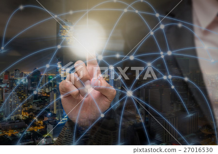 Businessman pointing with digital network line and circles over Top view of Bangkok Cityscape with mahanakhon at night background, business technology concept Businessman pointing with digital network line and circles over Top view of Bangkok Cityscape with mahanakhon at night background, business technology concept 27016530
