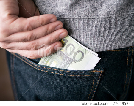 hand put Euro in jeans pocket 27019524