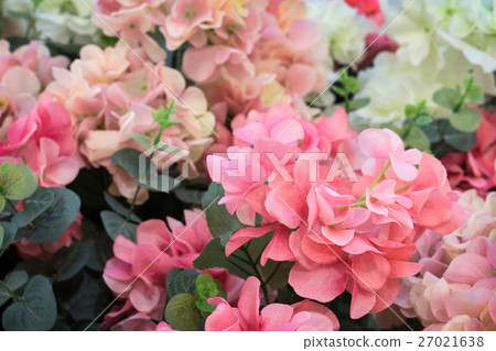 Pink and white plastic flowers. Pink and white plastic flowers. 27021638
