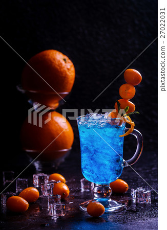 Blue cocktail in martini glasses Blue cocktail in martini glasses 27022031