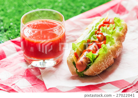 Hotdog with big sausage and fresh lettuce Hotdog with big sausage and fresh lettuce 27022041