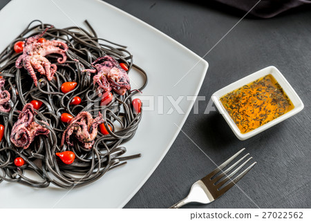 Pasta with black cuttlefish ink and octopuses Pasta with black cuttlefish ink and octopuses 27022562