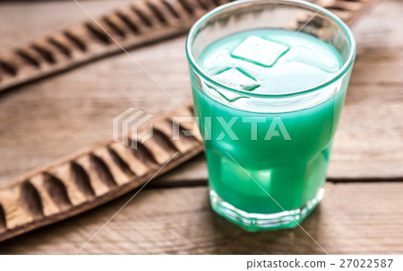 Glass of blue curacao and juice cocktail Glass of blue curacao and juice cocktail 27022587