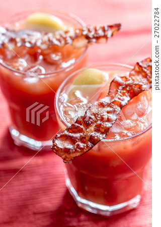 Two glasses of Bloody Mary with bacon rashers Two glasses of Bloody Mary with bacon rashers 27022784