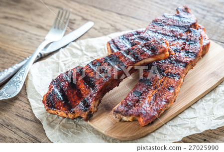 Grilled pork ribs on the baking paper 27025990