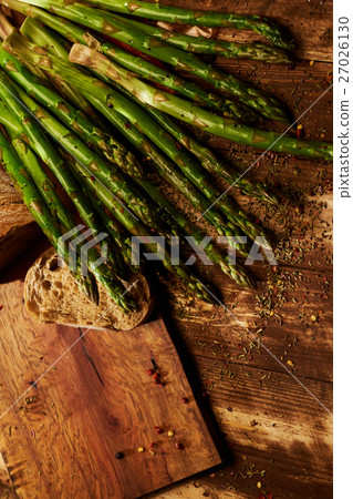 Still life with green asparagus and ciabatta bread 27026130