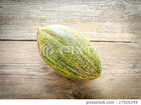 Piel De Sapo Melon On The Wooden Background 27026249