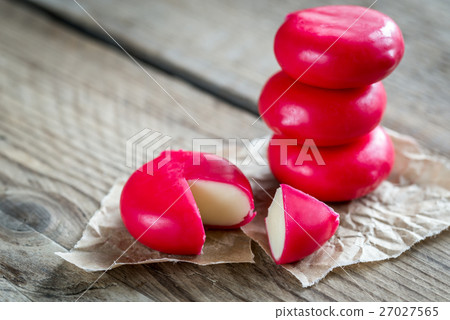 Stack of mini cheese on the wooden table 27027565