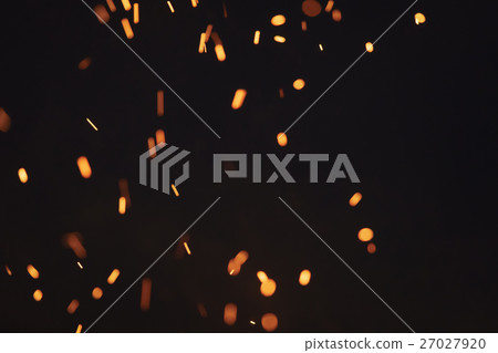 sparks from bonfire over dark night environment 27027920