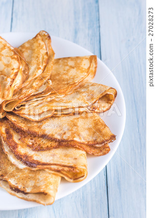 Pile of crepes on the plate Pile of crepes on the plate 27028273