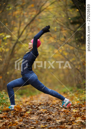Young woman on stretching exercises Young woman on stretching exercises 27028689