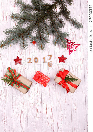 Fir branch lies over wooden numbers 2016  27030353