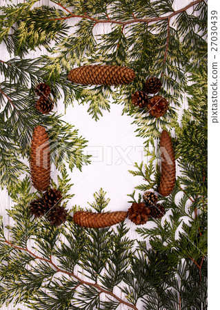 Frame made of conifer cones and green branches 27030439