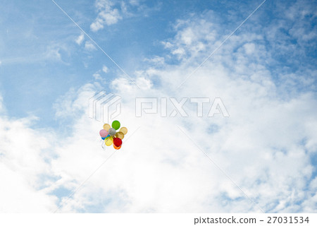 Colorful balloons fly in deep blue sky 27031534