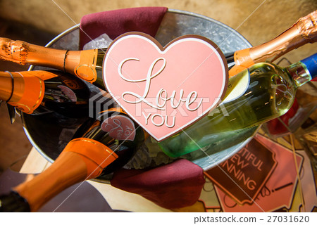 Pink card with lettering 'Love you' lies  27031620