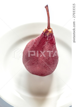 Merlot-poached pear on the plate 27033315