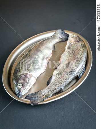 Fresh trouts in ice on the vintage metal tray Fresh trouts in ice on the vintage metal tray 27033318
