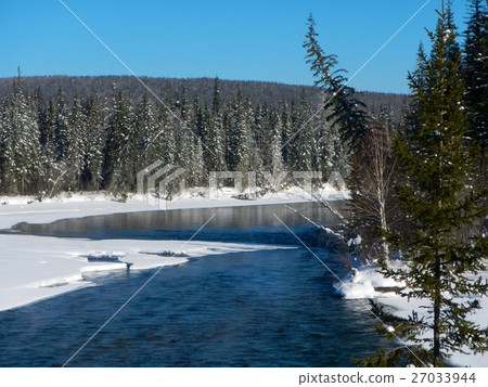 Beautiful winter sunset on the river in Russia Beautiful winter sunset on the river in Russia 27033944