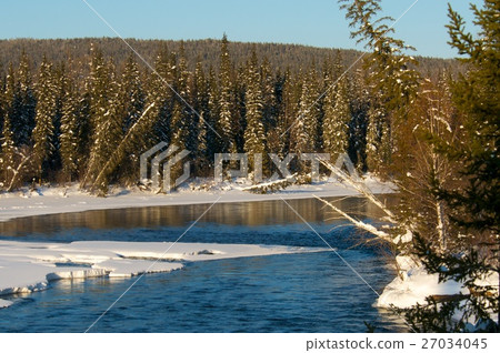 Beautiful winter sunset on the river in Russia Beautiful winter sunset on the river in Russia 27034045