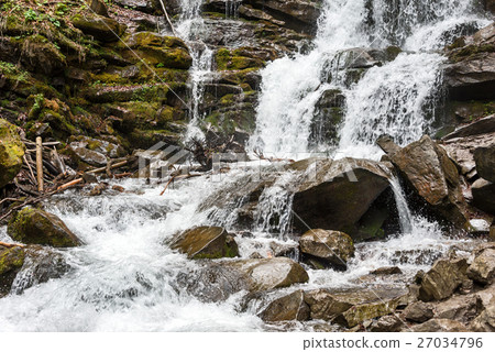 Forest waterfall and rocks covered with moss 27034796