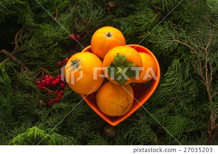 Persimmon, asian sweet fruit,source of vitamins. Persimmon, asian sweet fruit,source of vitamins. 27035203