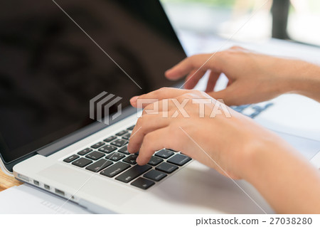 Closeup of business woman hand typing on laptop keyboard . 27038280