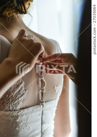 Garter on the leg of a bride, Wedding day moments Garter on the leg of a bride, Wedding day moments 27039064