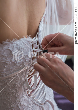 Garter on the leg of a bride, Wedding day moments Garter on the leg of a bride, Wedding day moments 27039068
