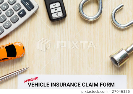 approved vehicle insurance claim form with car key 27046326