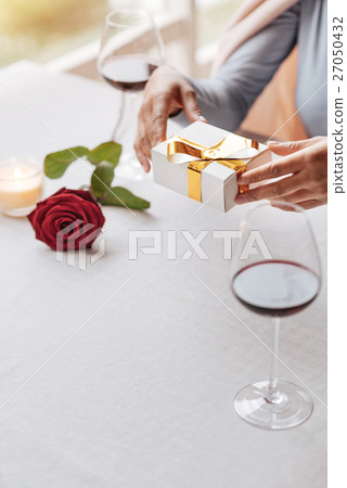 Cheerful young African American woman celebrating Cheerful young African American woman celebrating 27050432