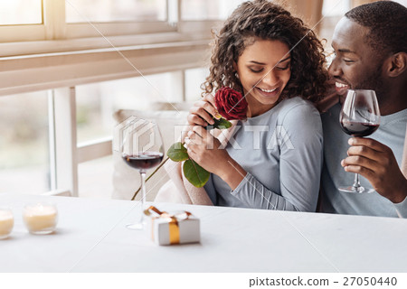 Positive African American couple hugging in the Positive African American couple hugging in the 27050440